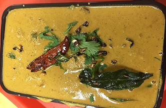 Jalapenos cooked in sauce made from peanuts.
