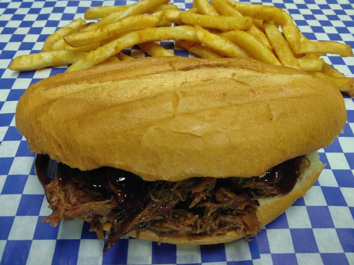 Grilled bolillo bun filled with smoked pulled pork and fries. 
*Deluxe adds cheese, pickles and chipotle-mayo sauce.