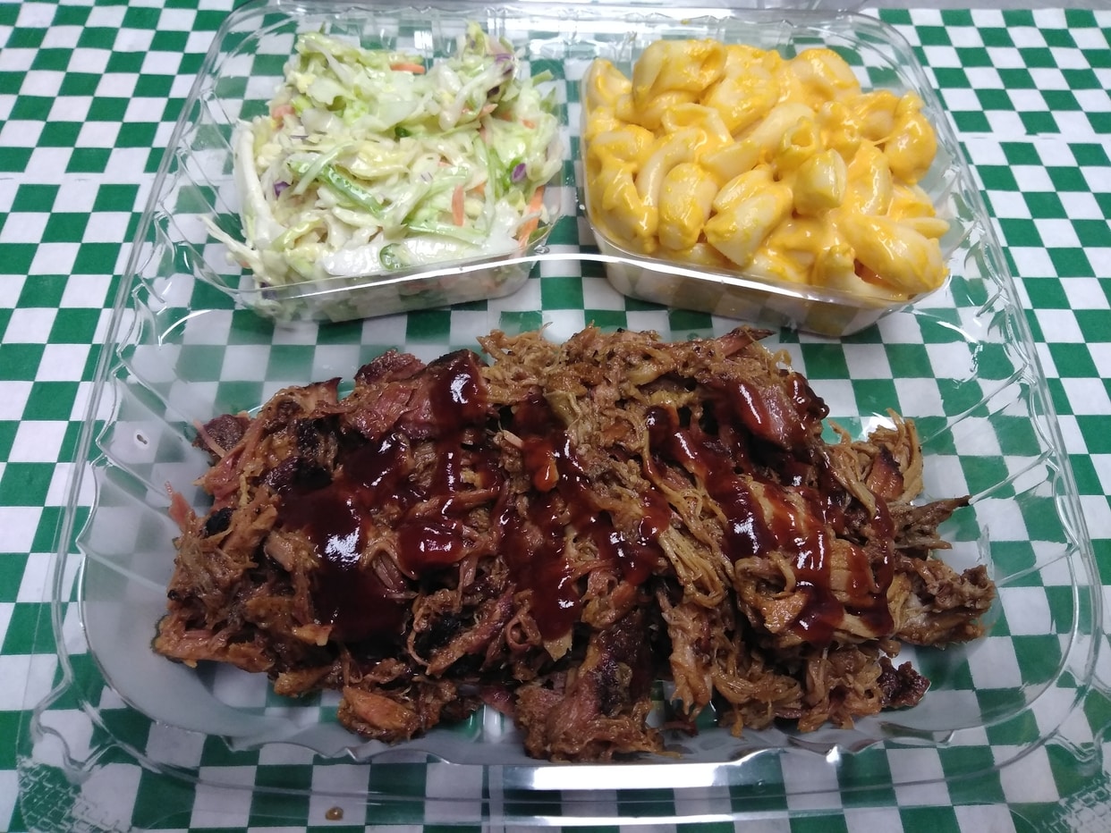 Smoked pulled pork served with choice of BBQ sauce and choice of 2 sides.