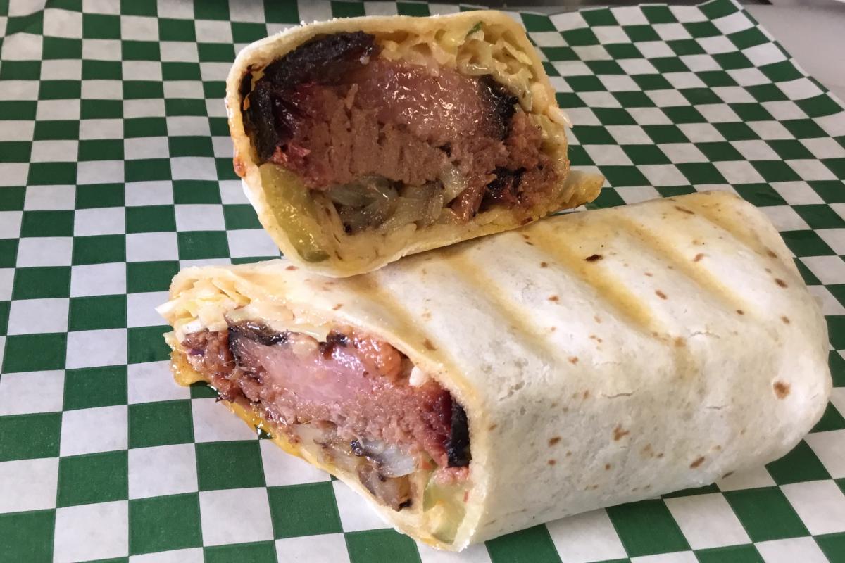 Choice of slow-smoked BBQ meat, shredded cheese, sautéed onions, all wrapped in a grilled flour tortilla with BBQ sauce; side of fries. - Raining BBQ & Grill restaurant in Beaverton, OR