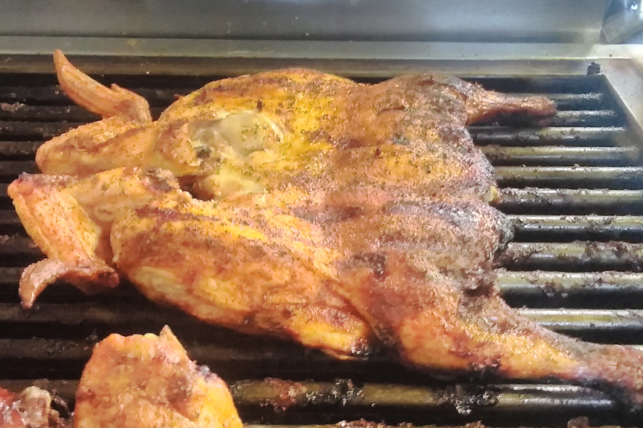 2 pieces of flame-broiled chicken served with 2 regular sides and BBQ sauce.