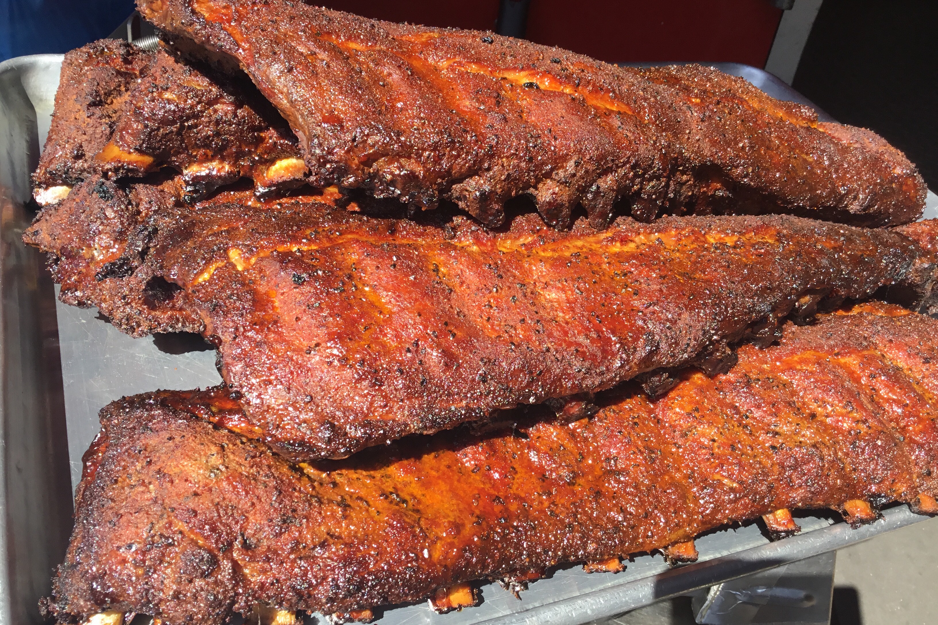12 bones (full slab) of smoked Raining BBQ signature baby back ribs served with 2 large side orders and choice of BBQ sauce.