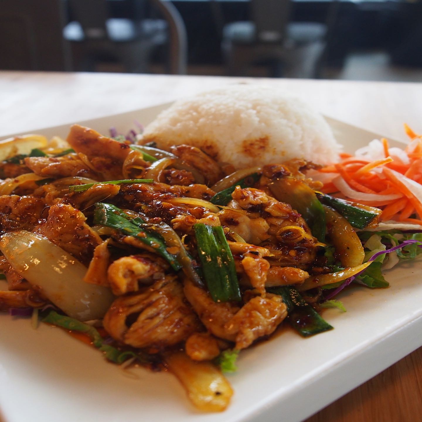 Tender chicken breast slices stir-fried with lemongrass, chili and onion, tossed in rice wine and garlic oyster sauce, served over jasmine rice.