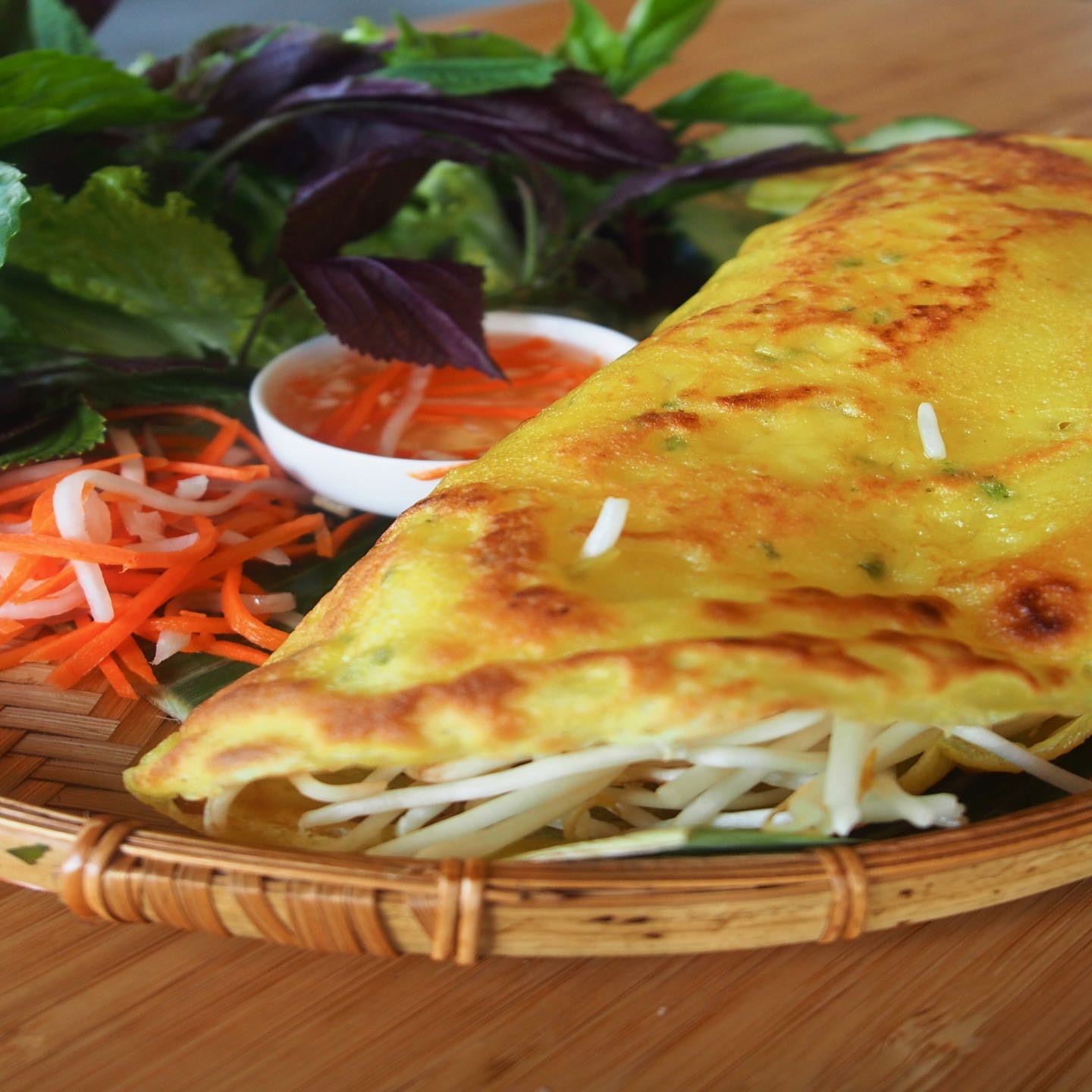 Savory crepe stuffed with shrimp, bean sprouts, jicama and mushrooms, served with fresh lettuce, and dipping sauce.