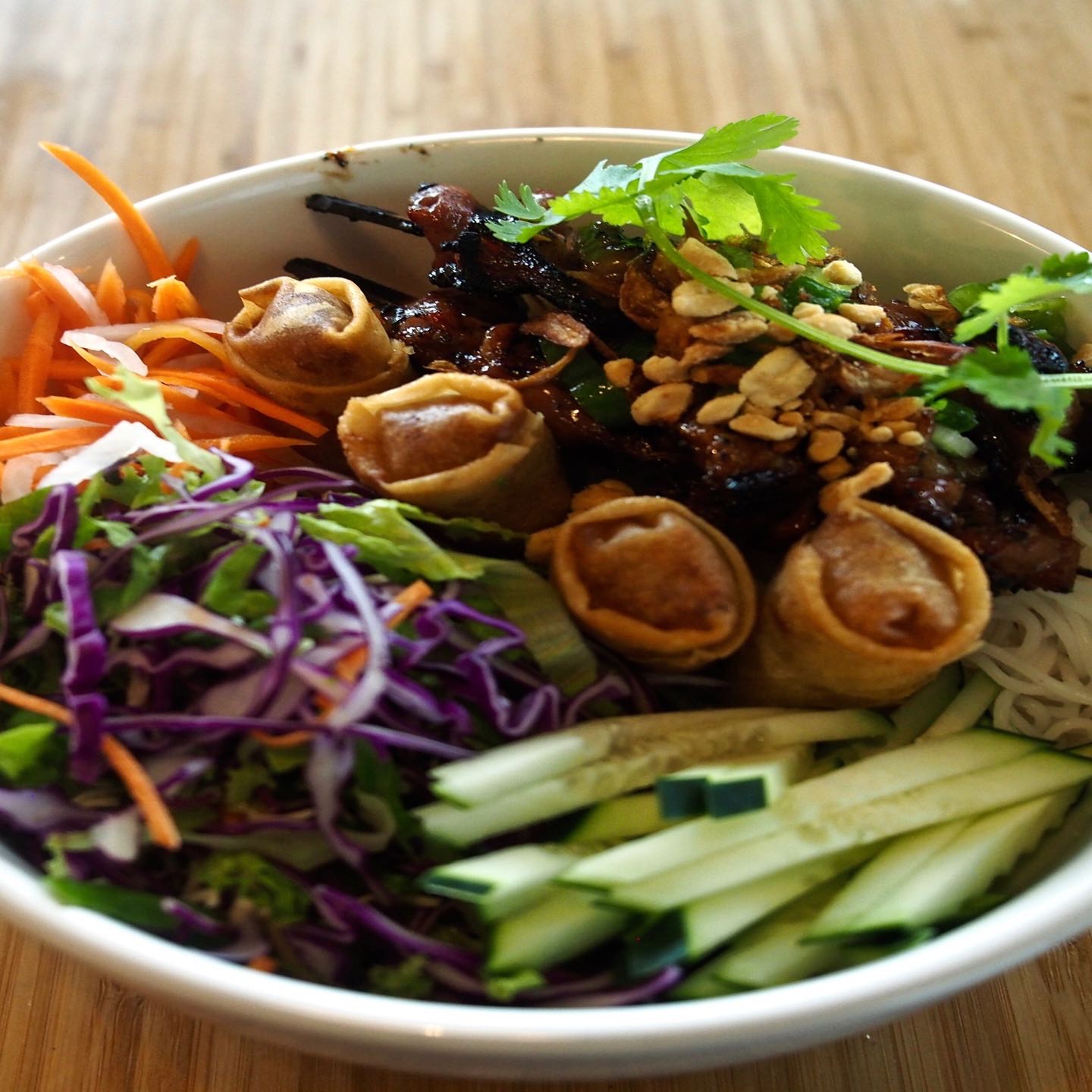 With assortment of grilled chicken, pork, beef and shrimp. Your choice of vermicelli noodles or jasmine rice with lettuce, mixed greens, spring roll, shallots, roasted peanuts. Served with fish sauce dressing or vegetarian dressing.