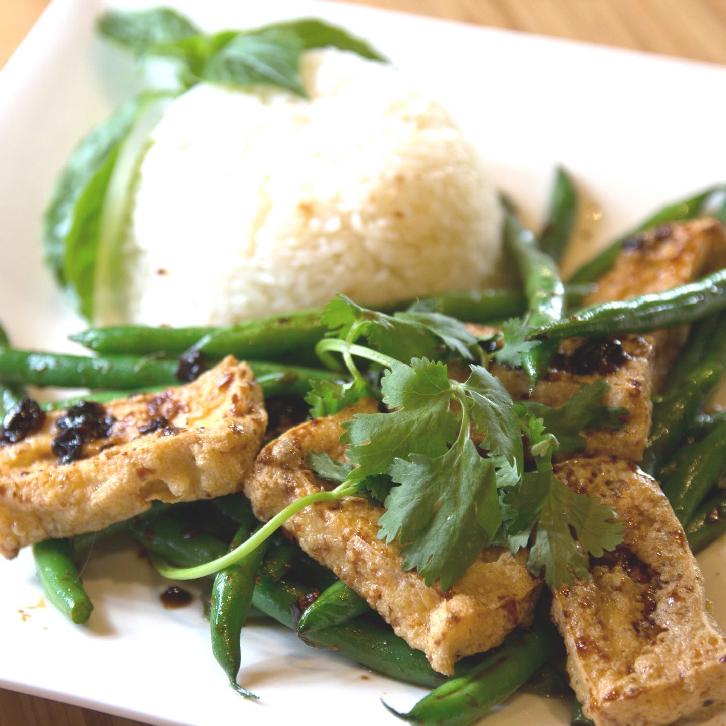 Crispy green beans tossed in rice wine, toasted garlic and homemade black bean sauce, served with jasmine rice.