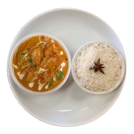 Chicken marinated in a spiced yogurt mixture and tossed with bell peppers and onions in rich and creamy sauce.