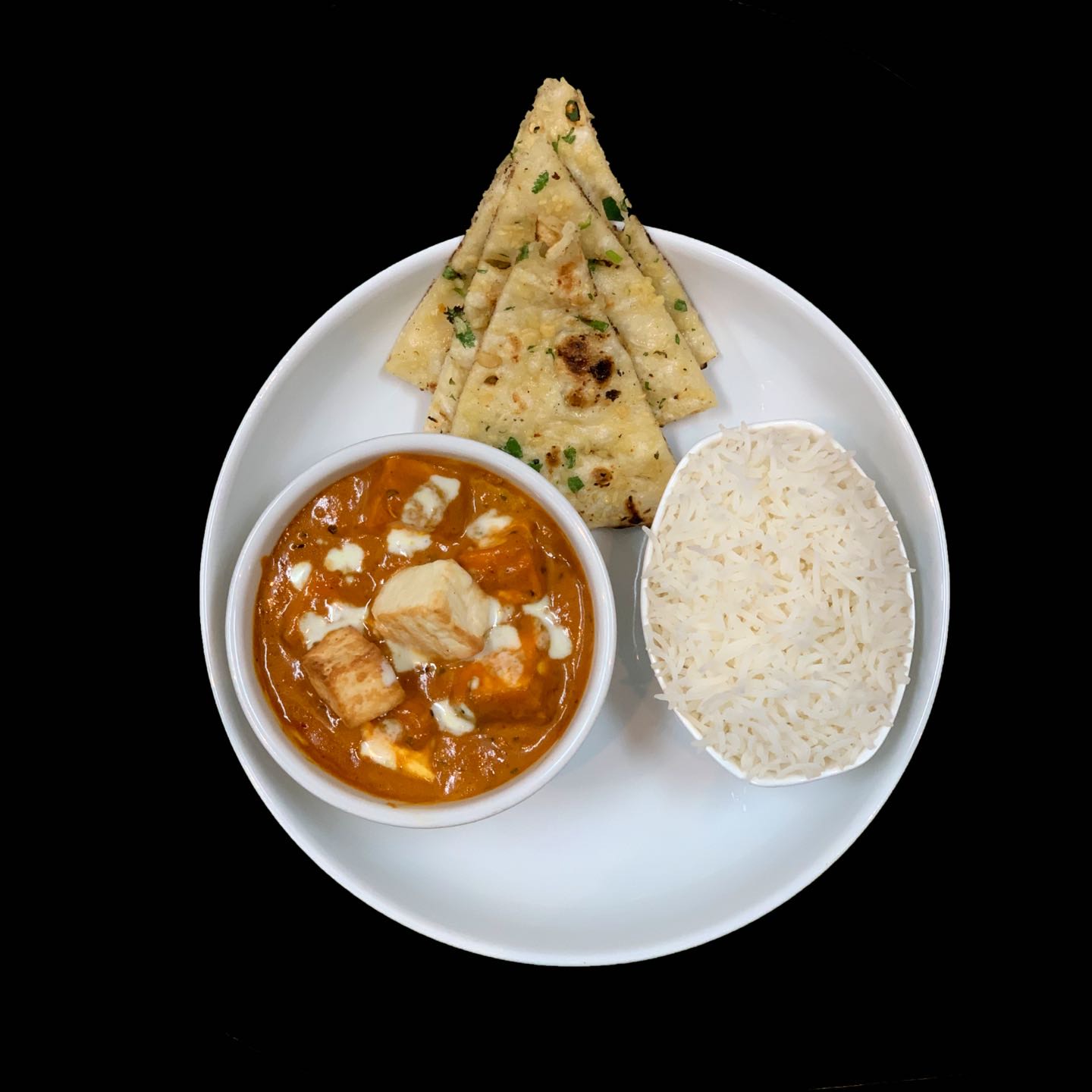 Homemade cheese cubes & tomatoes cooked with curry sauce.