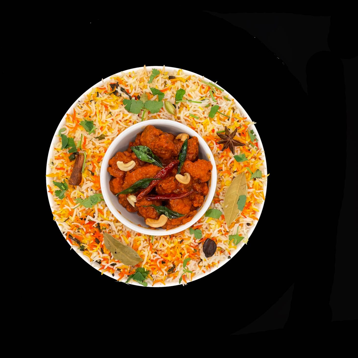Marinated chicken pan-cooked in sour and spicy sauce, then layered in Biryani.
