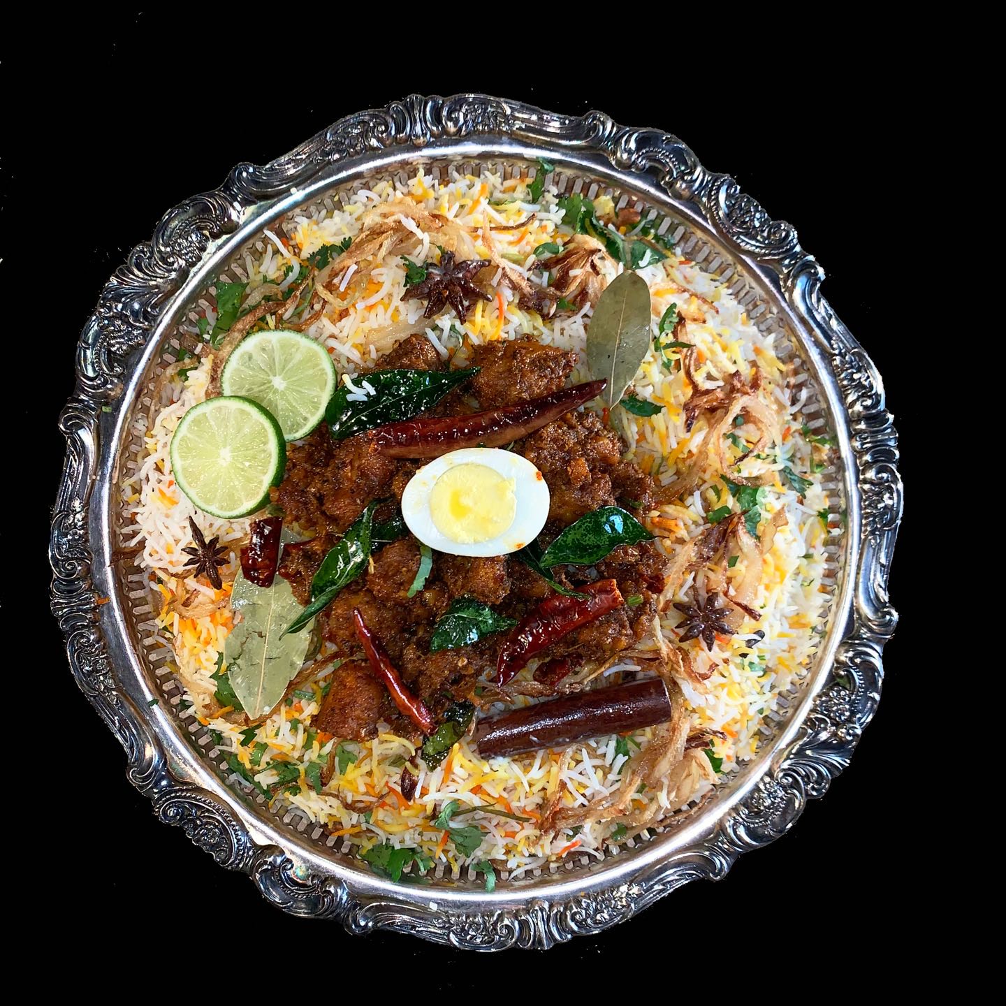 Marinated chicken pan-fried in South Indian style, then layered in Biryani.