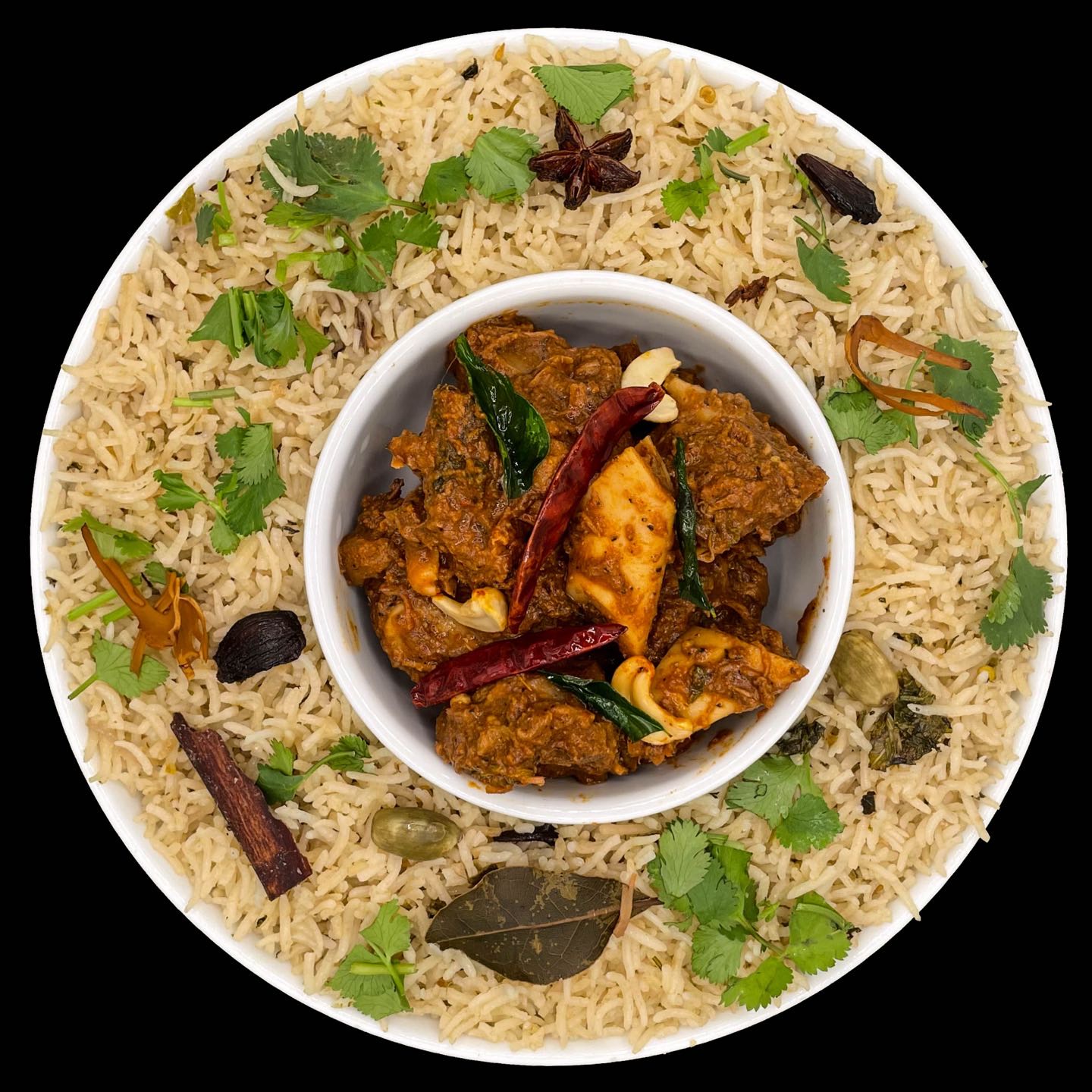 Basmati rice cooked in sealed brazier with coconut milk & herbs, then layered with fried goat meat.