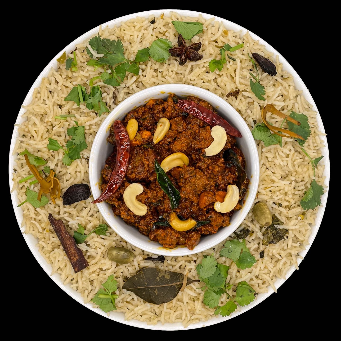 Basmati rice cooked in sealed brazier with coconut milk & herbs, then layered with ground goat meat curry.