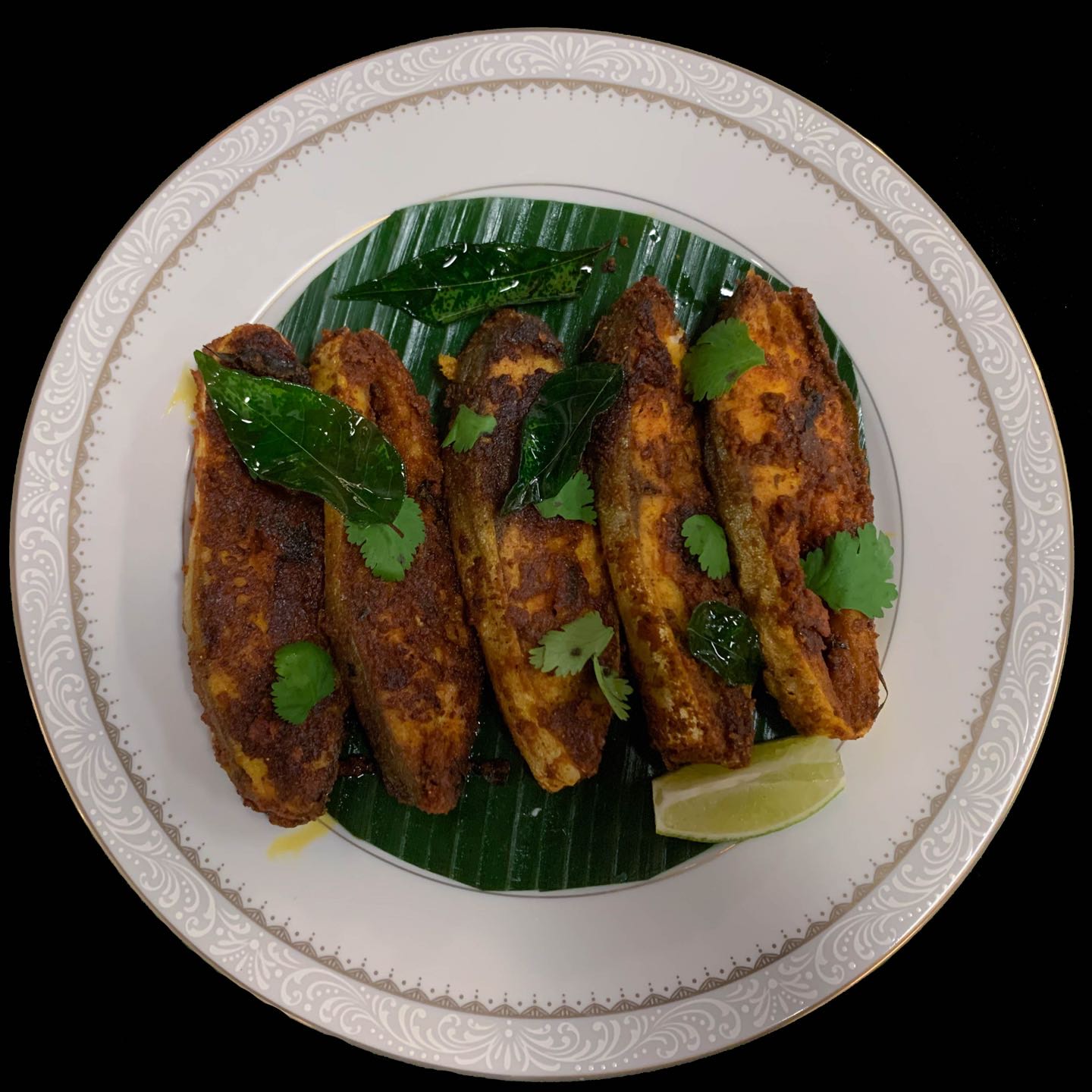 Pomfret steaks are marinated with south spices seasonally and cooked in slow fire.