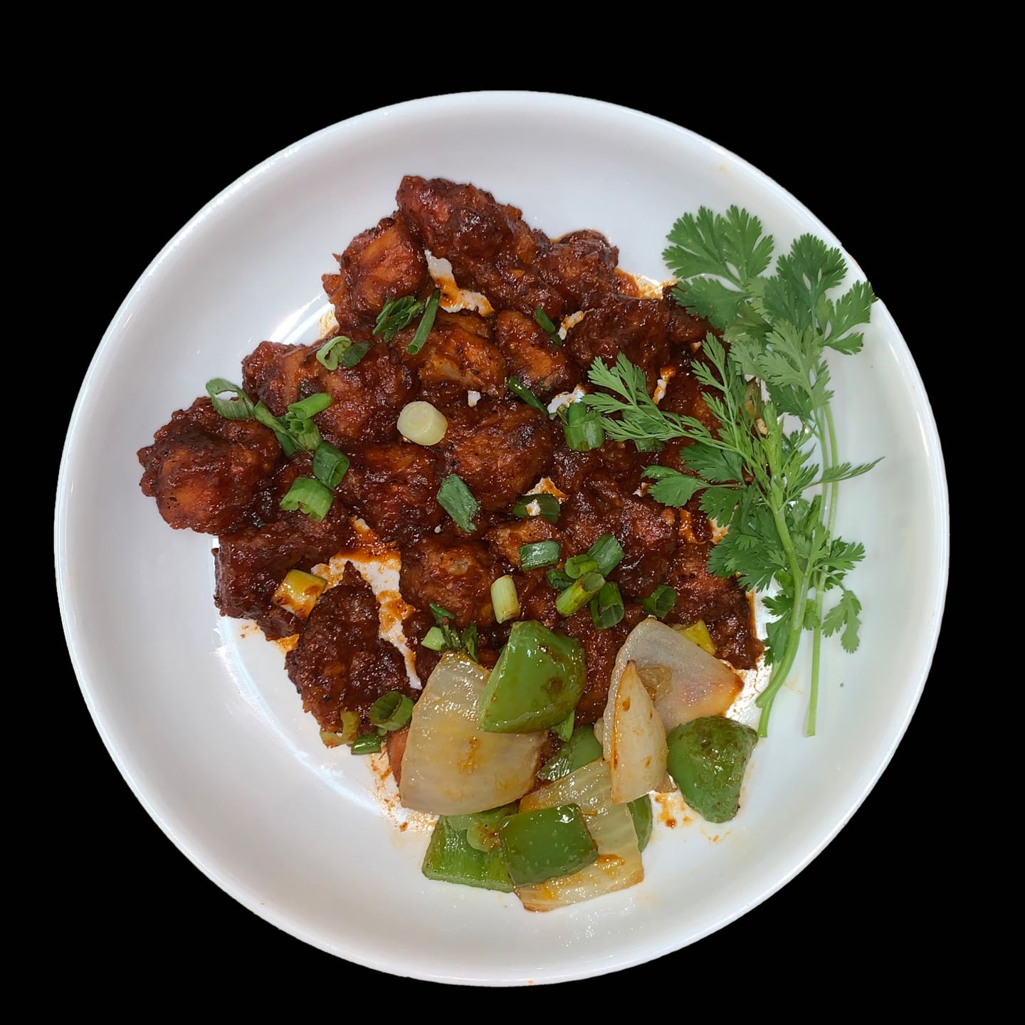 Crisped fried chicken sautéed in Indonesia’s Chinese sauce.
