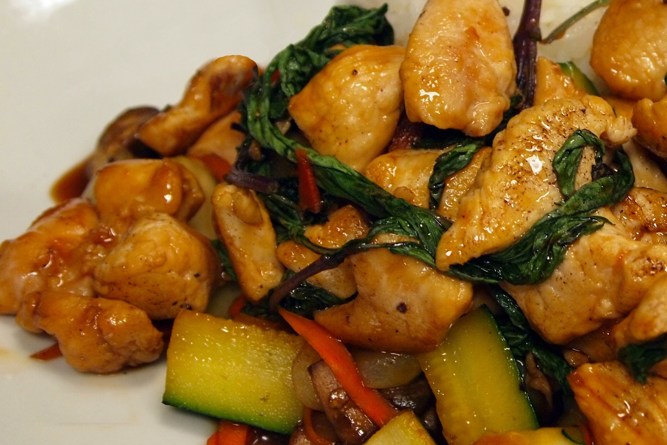 Grilled chicken sautéed in house made sweet teriyaki sauce and savory basil served with vegetables and white rice