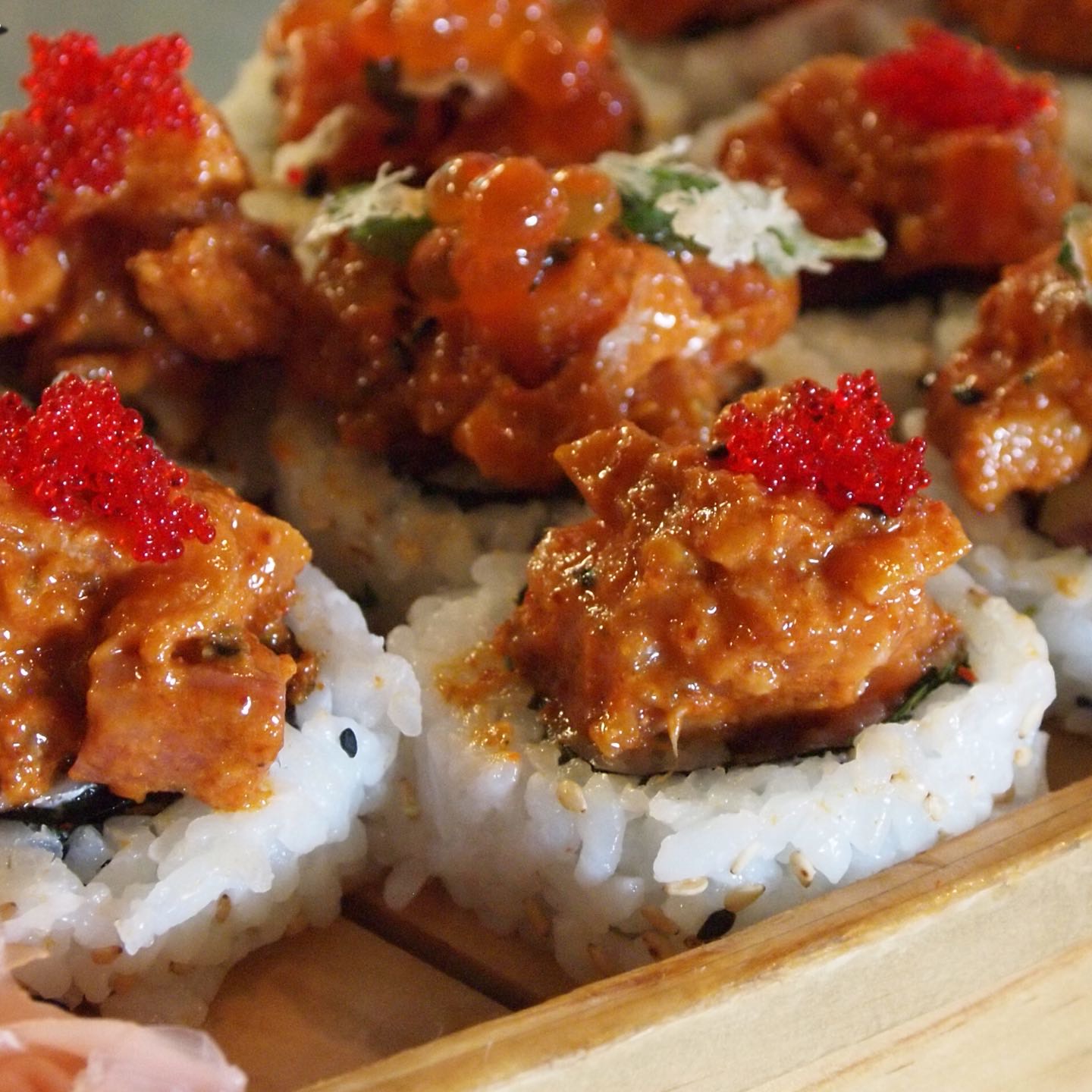 Tuna, salmon, hamachi, spicy tuna, asparagus, cucumber topped with spicy tuna, tuna, salmon, hamachi, tobiko and mint