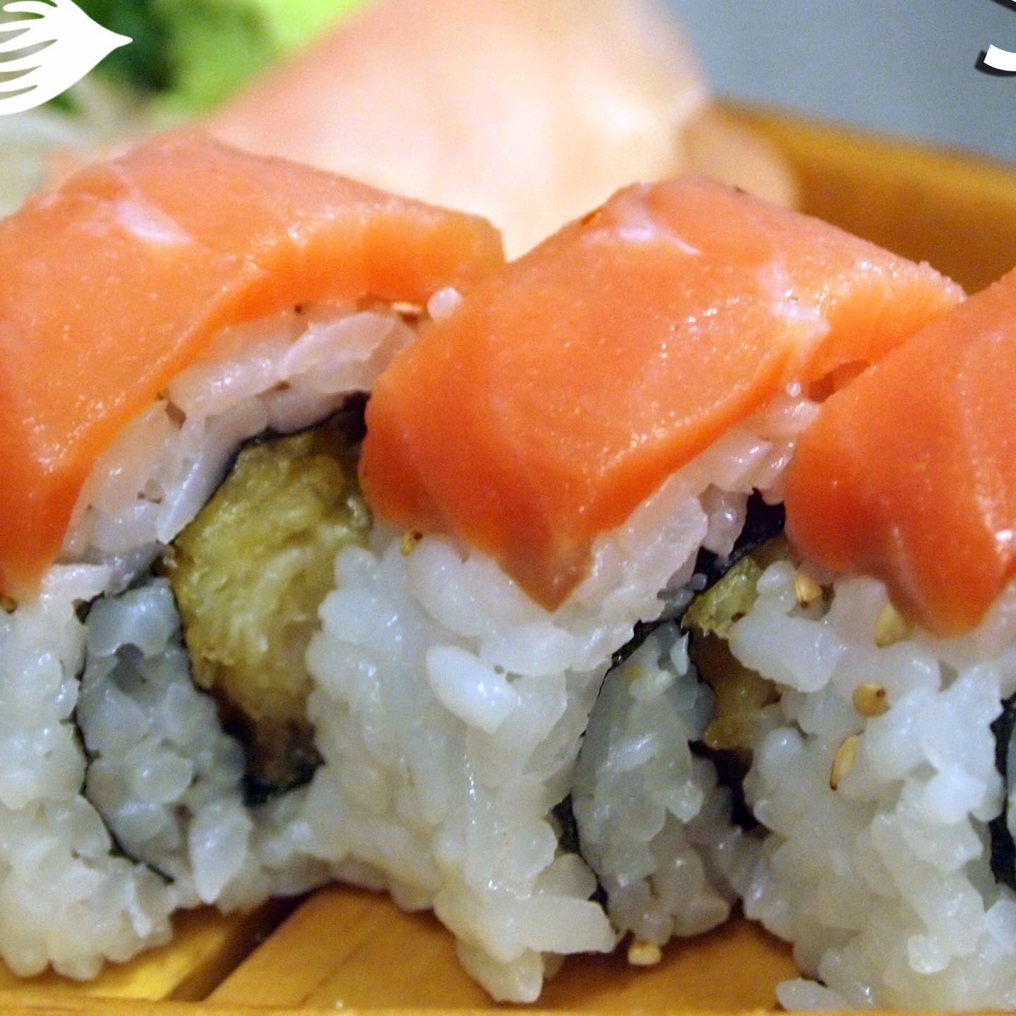 Smoked salmon atop a shrimp tempura roll with our sweet sauce