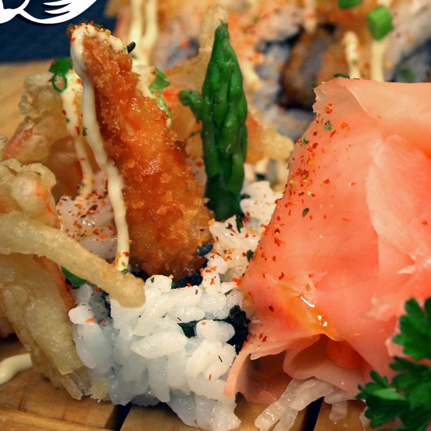 Coconut shrimp, tempura Krab, asparagus, avocado, scallions, masago, lime zest, chili oil, five spices and Japanese mayo.