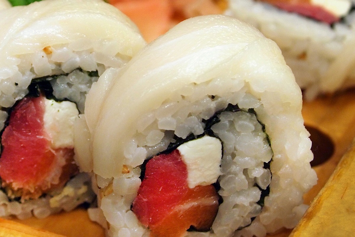 Salmon, maguro, cream cheese and tempura crunch makes up this roll. The escolar finishes it white then covered in our sweet and spicy sauce