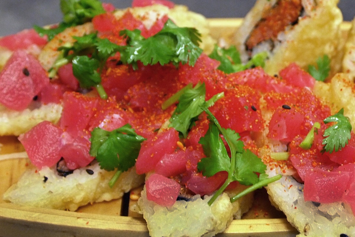 Tempura Spicy Tuna roll topped with chunk maguro tuna drizzled with spices and spicy mayo sauce