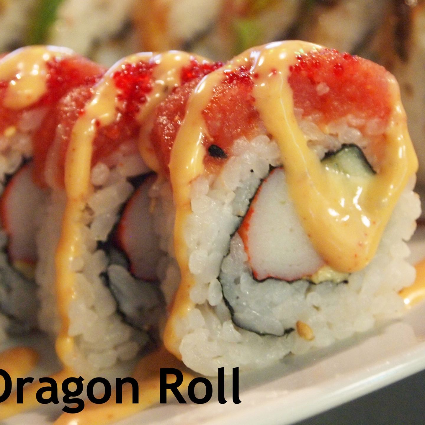 California Roll topped with spicy tuna, red tobiko, and our spicy sauce