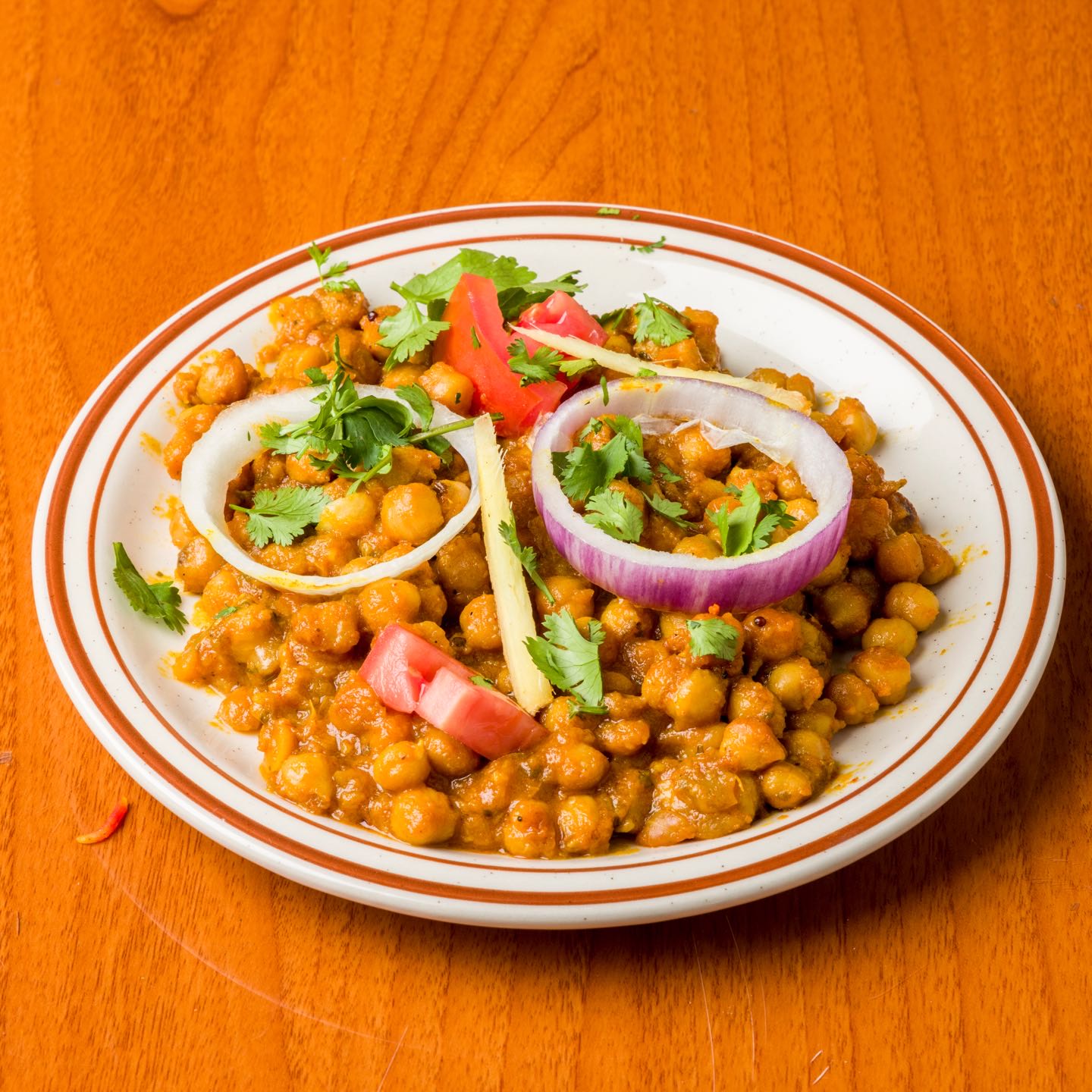 Garbanzo beans with ginger in a specialty spiced sauce. Served with rice.