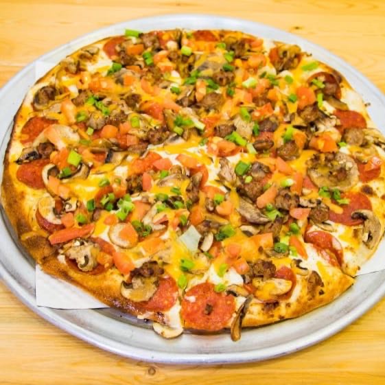Pepperoni, Italian Sausage, Fresh Mushrooms, Mozzarella Cheese, Fresh Tomatoes, Cheddar Cheese & Green Onions with our Garlic White Sauce.