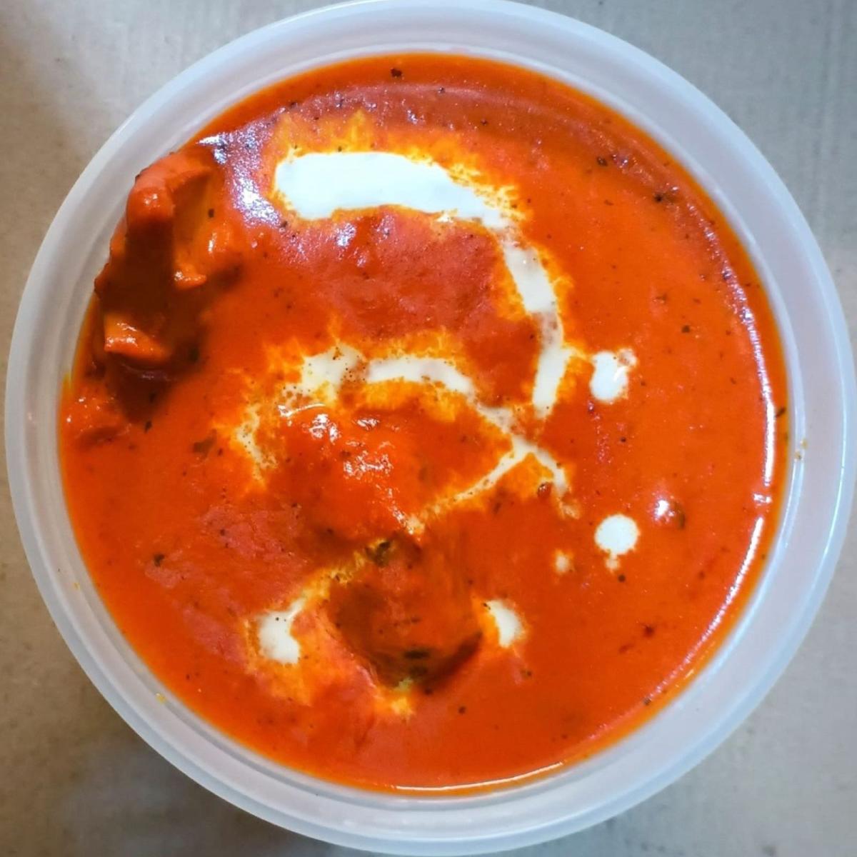 Boneless chicken cooked in butter with spices, cream and almonds. - Flavours of India restaurant in Portland, OR