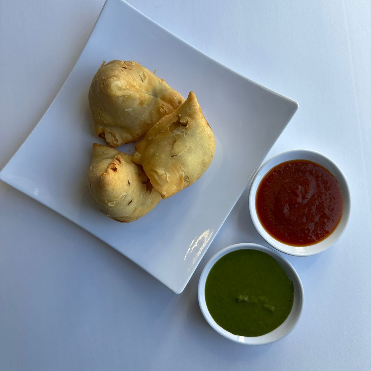 Crispy, golden pastry filled with a spiced mixture of potatoes, peas, and aromatic spices.