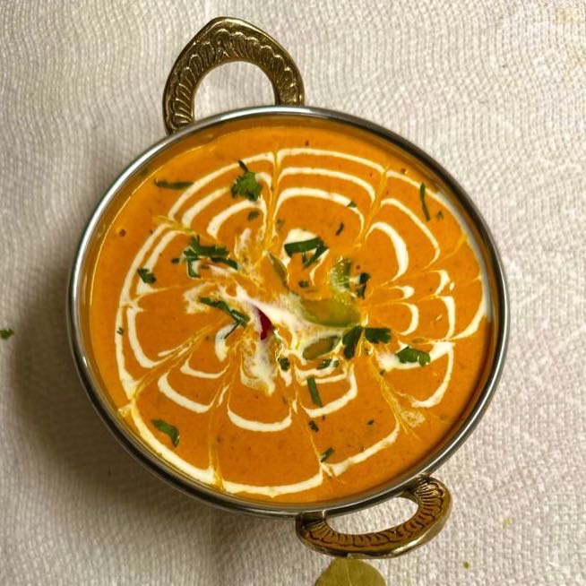 Succulent pieces of lamb, marinated in aromatic spices and yogurt, grilled to perfection and simmered in a rich, creamy tomato-based sauce. Served with steamed rice.