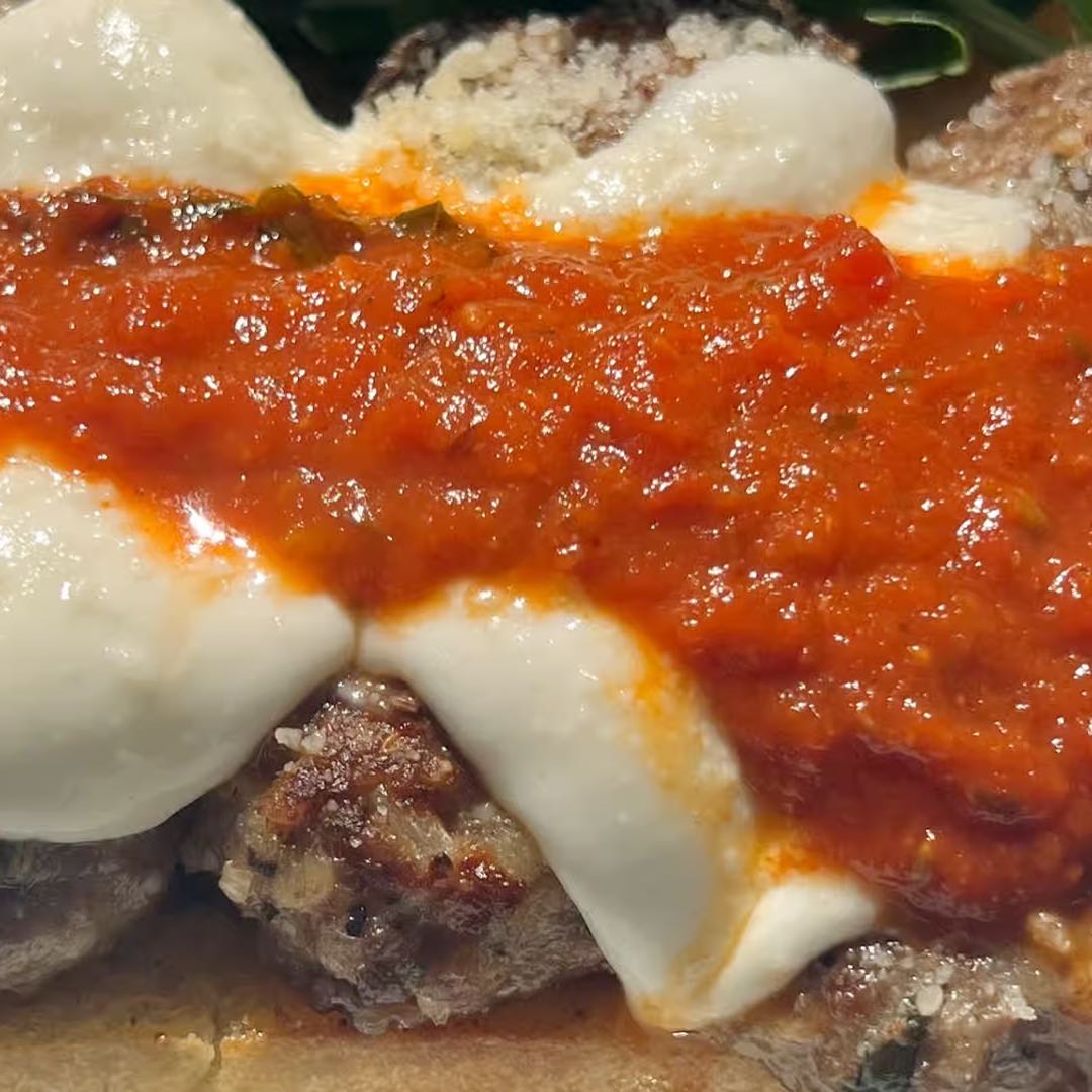 House made beef and pork meatballs with fresh mozzarella, tomato basil sauce, basil pesto, and arugula greens on your choice of focaccia or ciabatta bread.