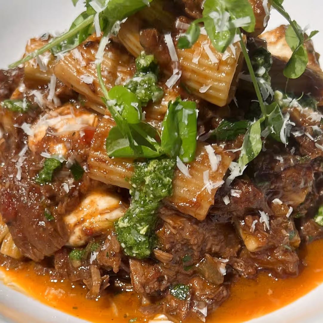 Rich tomato sauce with braised pork or wild mushrooms, basil, fresh mozzarella, Reggiano, and fin herbs. served with toasted bread.