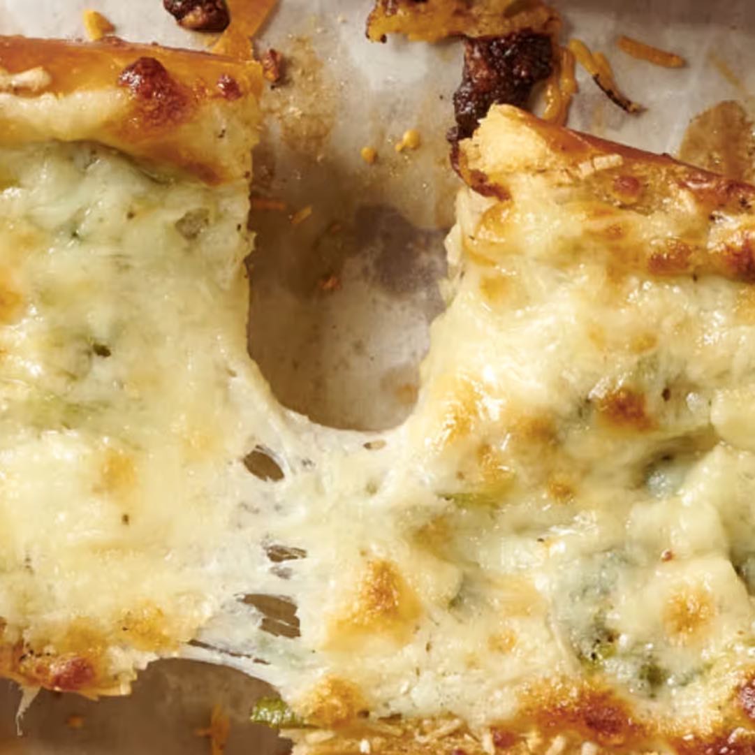 Toasted french roll with Parmesan butter, mozzarella, and garlic, topped with truffle oil and cracked black pepper.