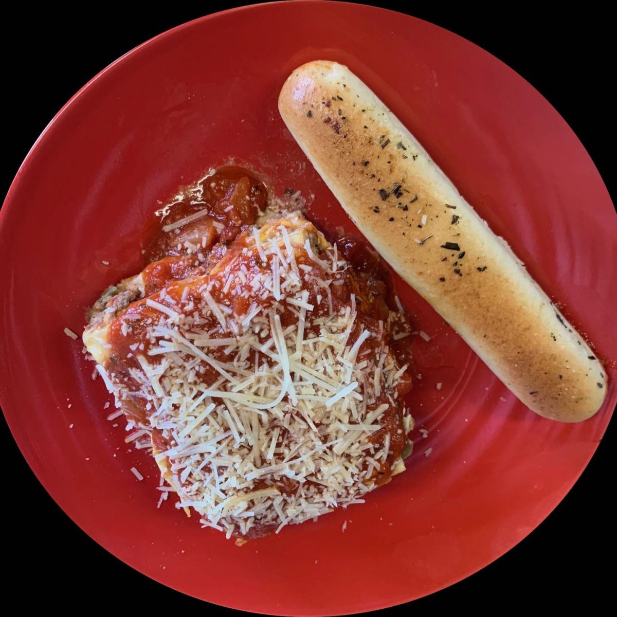 Fresh made from scratch pasta layers filled with Italian ground beef, red-yellow & green peppers, mozzarella, Parmesan & ricotta cheese.  Served with an Italian break stick. - Spaghett-About It restaurant in Forest Grove, OR