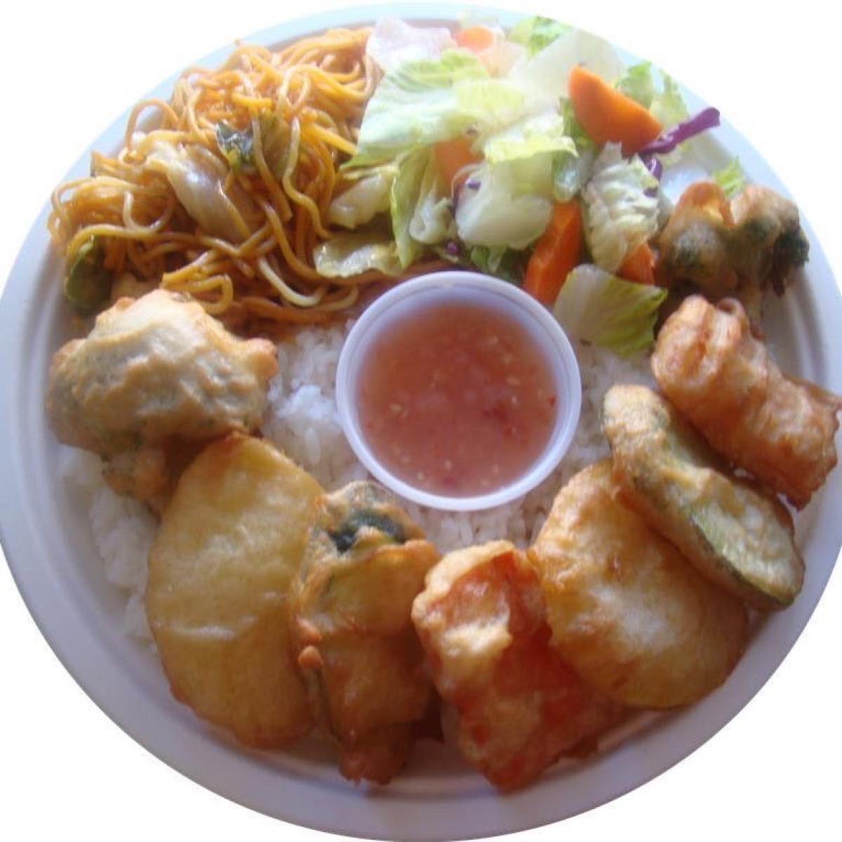 Veggie tempura served over teriyaki rice, with yakisoba needles & house made teriyaki sauce.  Served with sweet chilli sauce. - Lu’s Teriyaki restaurant in Forest Grove, OR