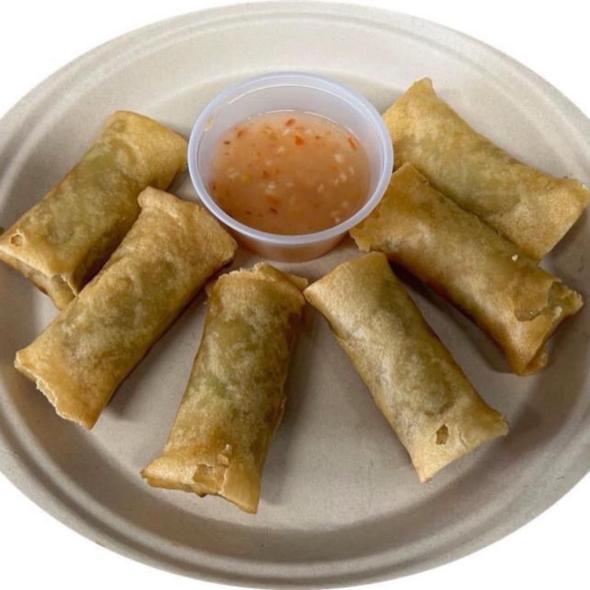Six veggie lumpias served with house made sweet chili sauce. - Lu’s Teriyaki restaurant in Forest Grove, OR