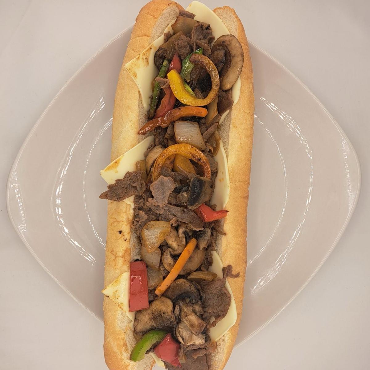 Any Cheese, sliced Ribeye with onions, peppers and mushrooms. - East Coast Eddie's Authentic Philly Cheese Steaks - Beaverton restaurant in Beaverton, OR