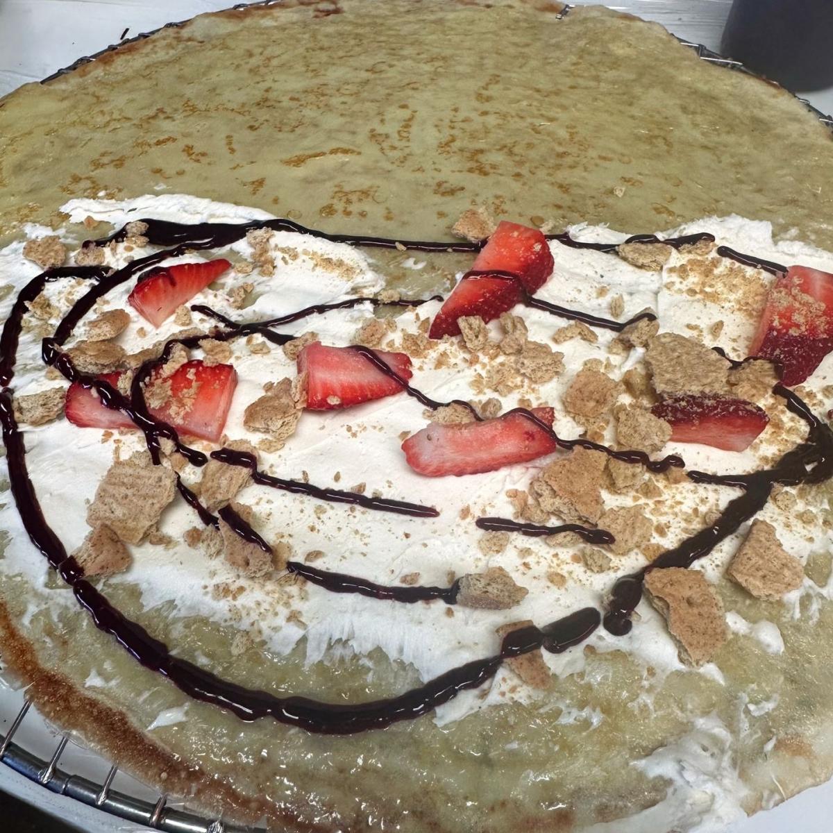 Whipped cream cheese mix, fresh strawberry, graham cracker & your choice of chocolate or mixed berry sauce. - Oh My Crepe restaurant in Hillsboro, OR