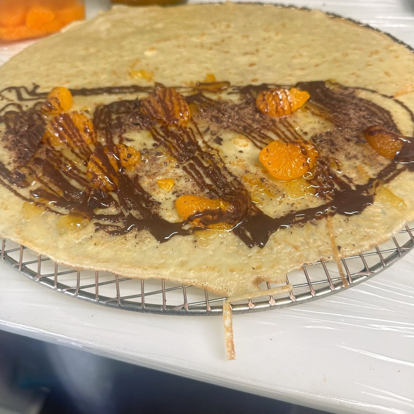 Yuzu jam, sliced oranges, chocolate shavings & chocolate drizzle.