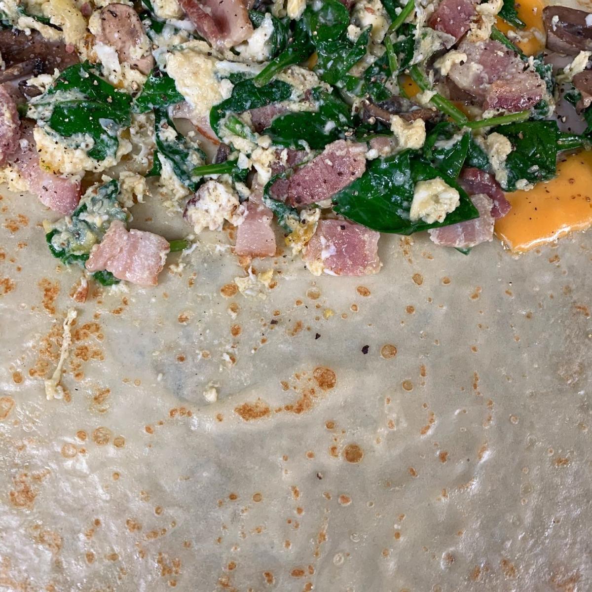 Scrambled egg, bacon bites (optional), cheddar cheese, sauteed mushrooms, spinach, salt & pepper. - Oh My Crepe restaurant in Hillsboro, OR