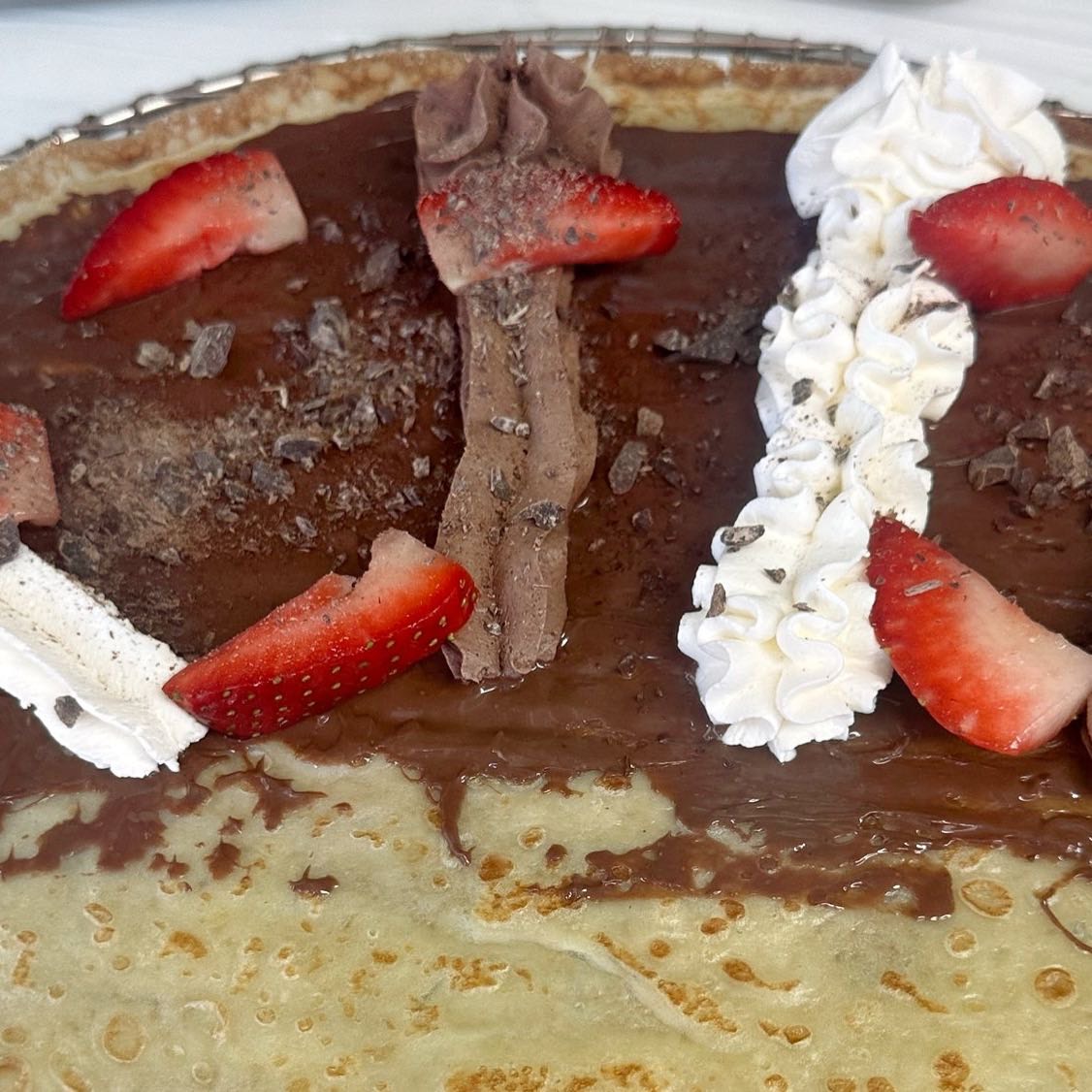Nutella, chocolate mousse, fresh strawberry, whipped cream & chocolate shavings.