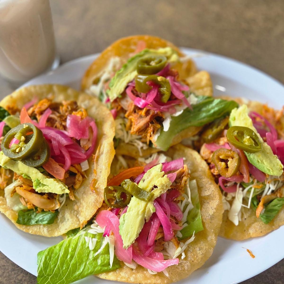 Handmade organic corn tortilla with choice of meat, lettuce, tomato, cabbage, red pickled onions, avocado & jalapeños. - Lindo Yucatan restaurant in Portland, OR