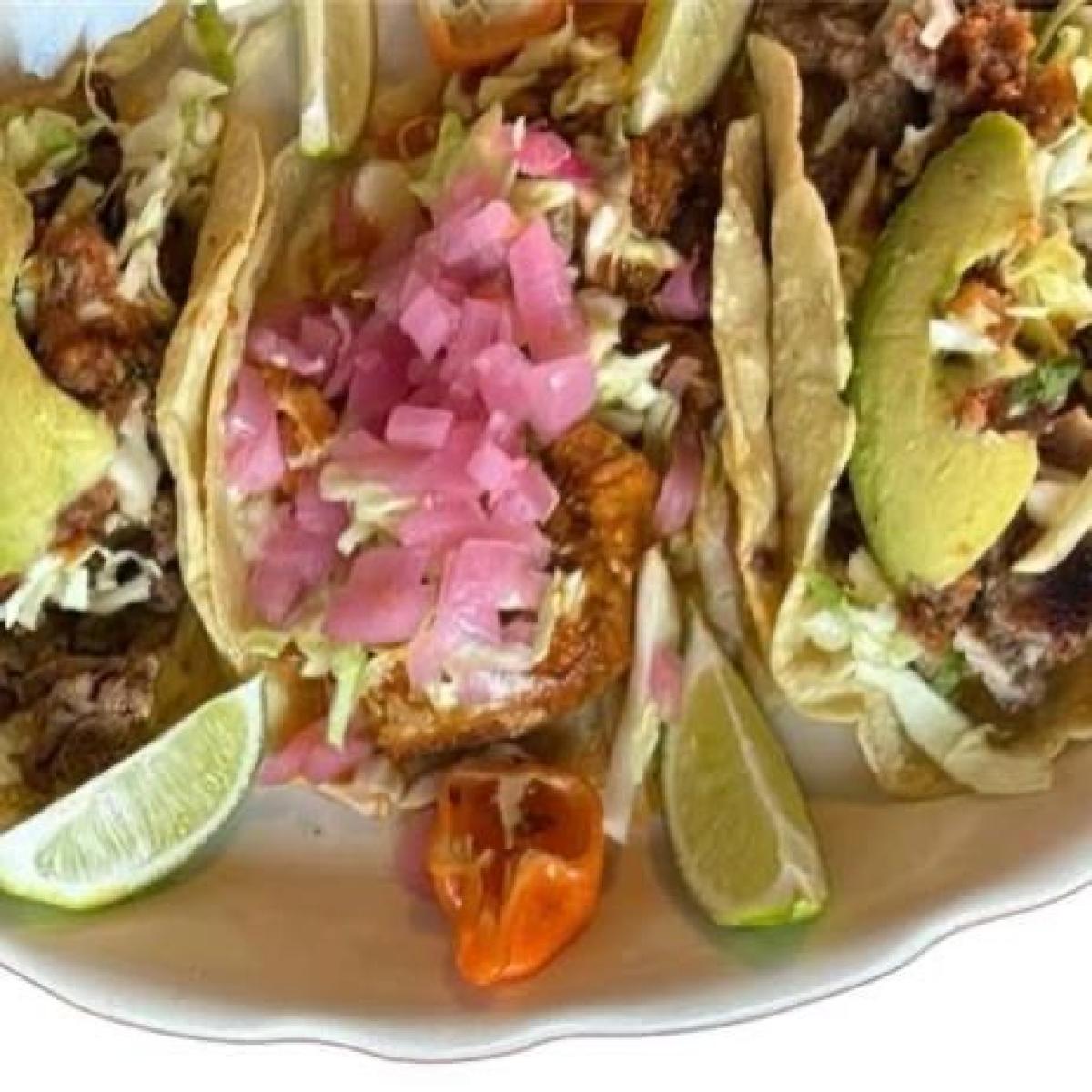 Handmade organic corn tortilla filled with choice of meat, black beans, cabbage, onions, house tomato salsa. - El Rinconcito Yucateco restaurant in Portland, OR