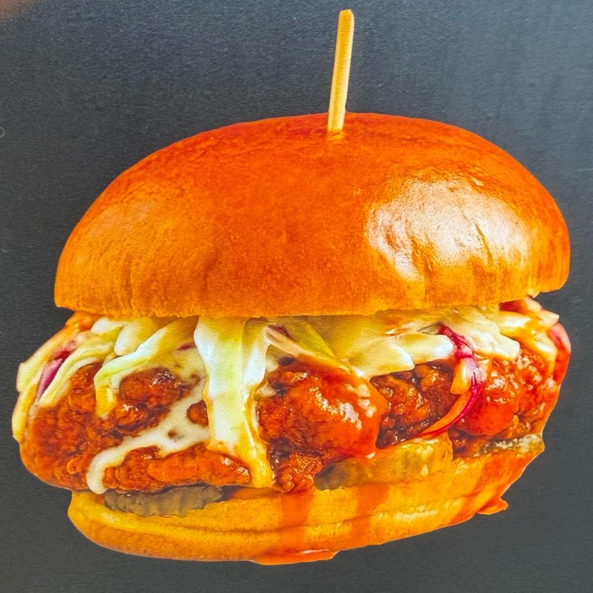 Comes with honey, butter, lettuce, cheese and house sauce. Served with fries. - Singh Is King Smashburger restaurant in Beaverton, OR
