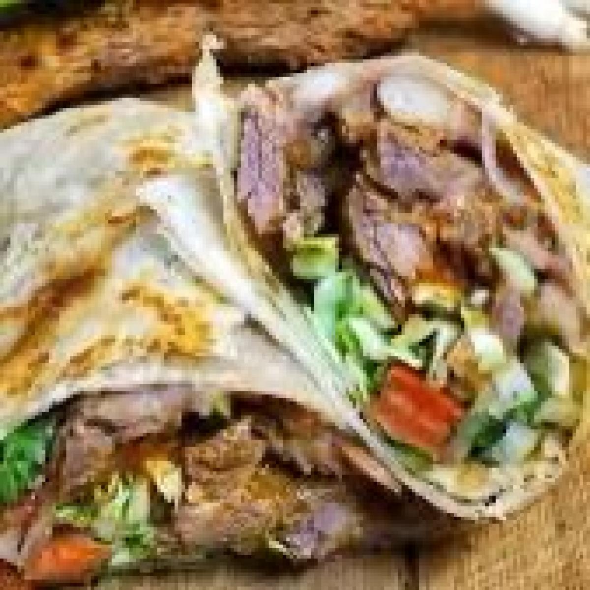 Slow cooked marinated tender chuck roast, pico de gallo, avocado, Mexican sour cream, beans, salsa and Mexican rice. - Chorizo Hub restaurant in Beaverton, OR