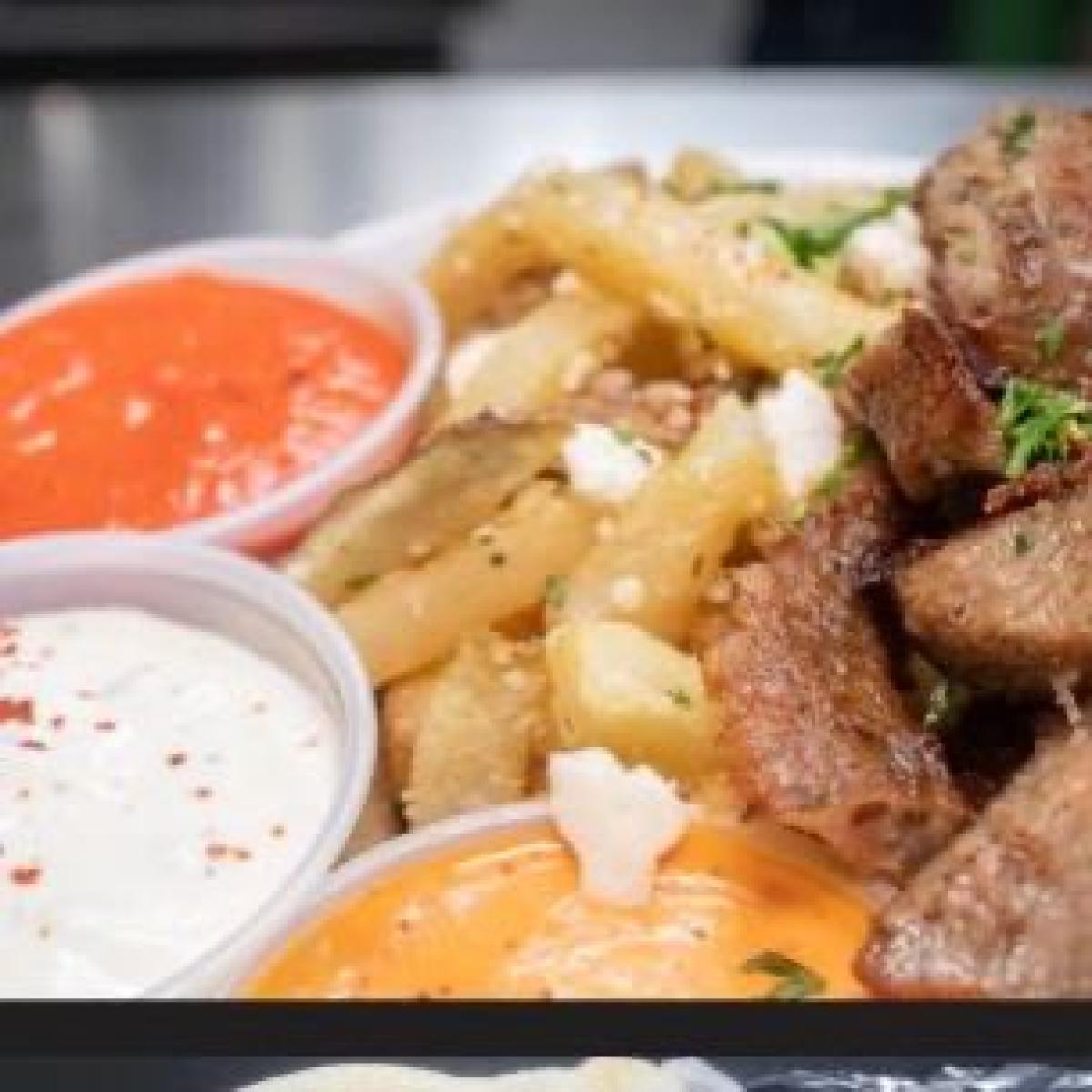 Fries with your choice of protein, topped with tzatziki, feta, parmesan, herbs, garlic sauce. - Aybla Grill restaurant in Beaverton, OR