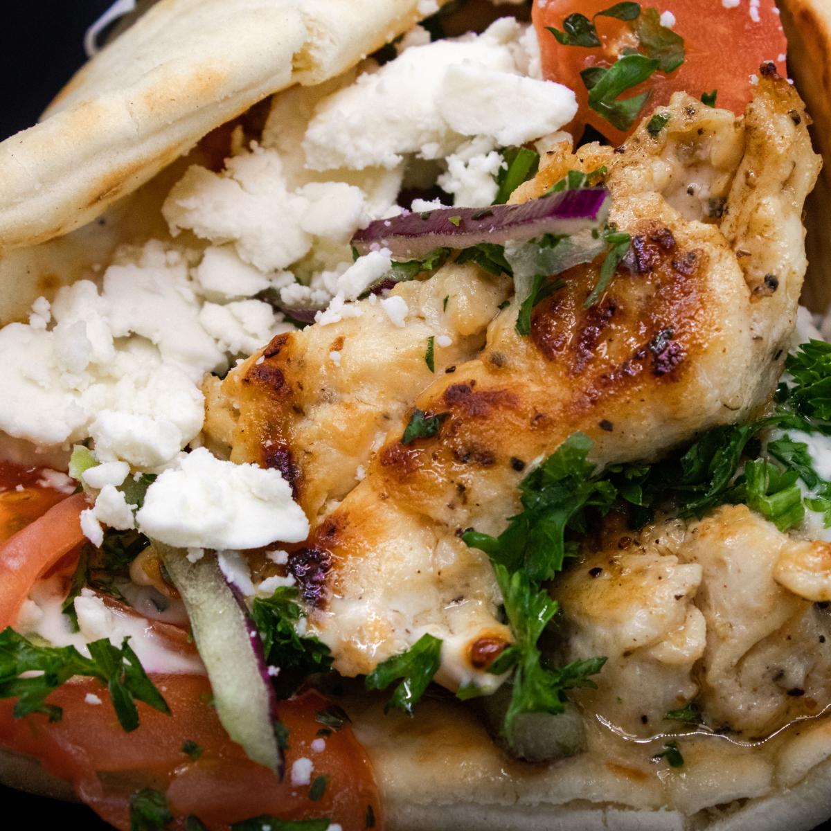 Grilled lamb and beef or freshly-grilled chicken served in a bigger size pita with more meat than the regular Gyro, plus Greek feta cheese. - Aybla Grill restaurant in Beaverton, OR