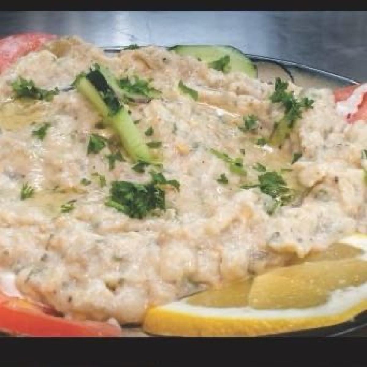 Grilled eggplant blended with garlic, lemon juice, mixed herbs and tahini sauce.  Served with pita bread.  Add chicken or lamb for $6. - Aybla Grill restaurant in Beaverton, OR