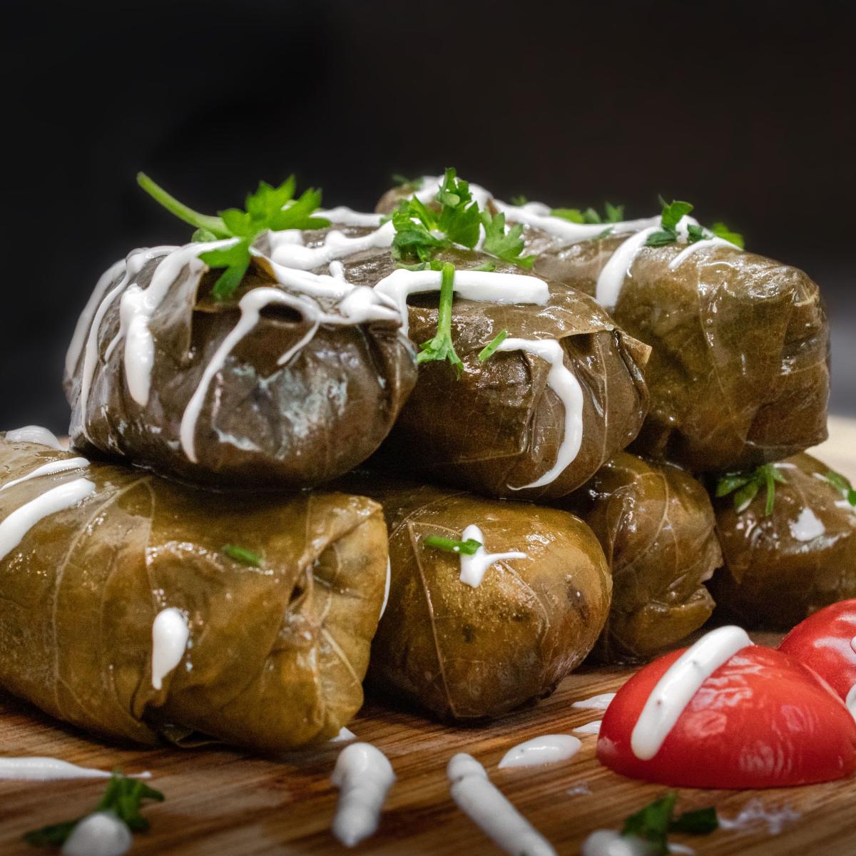 Grape leaves stuffed with rice and herbs.  Served cold with tzatziki sauce. - Aybla Grill restaurant in Beaverton, OR